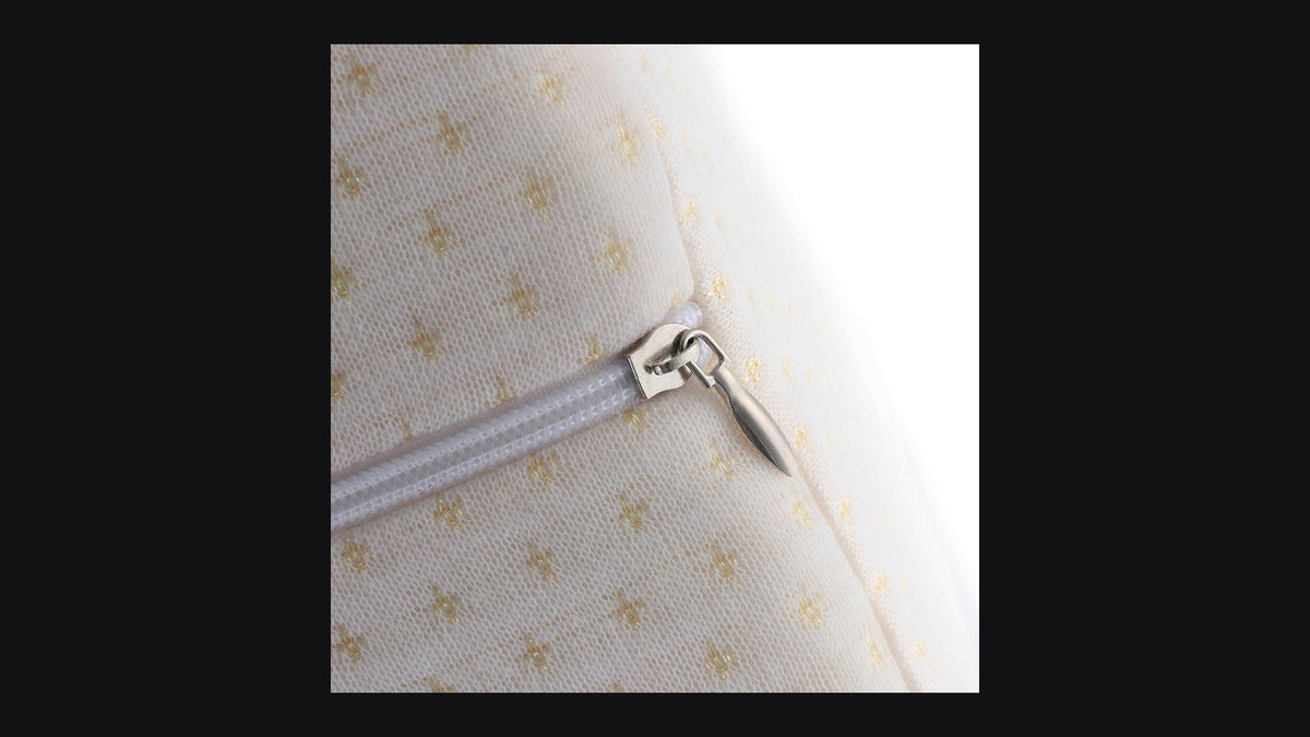 Ergonomic contoured knee pillow for side-sleeper hip and spine alignment on dark editorial backdrop