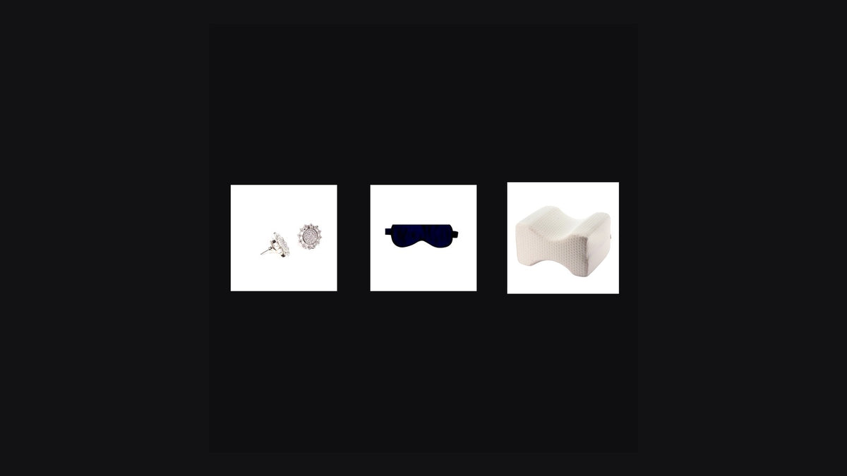 Eight Meridian Circadian Reset Bundle — flat-back studs, silk sleep mask, and knee pillow on dark editorial backdrop