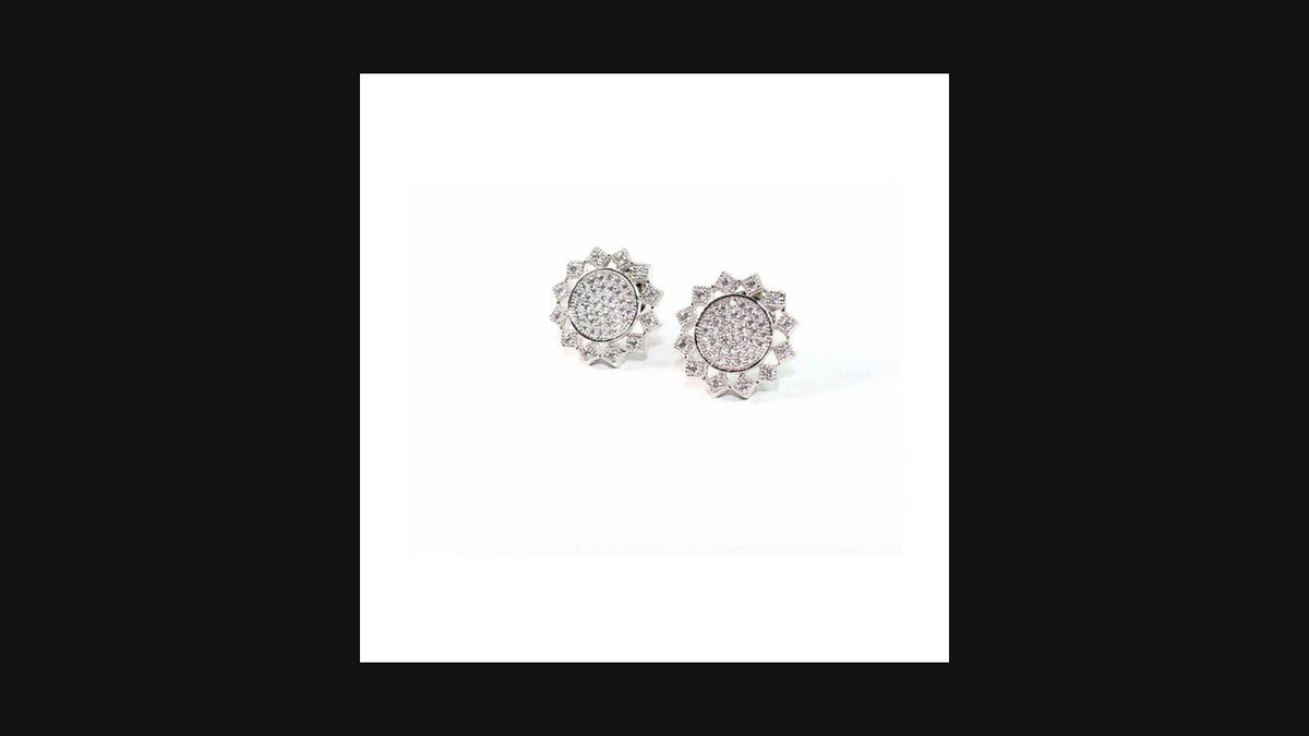 Pair of sparkling flat-back SnoozeStuds sleep earrings for side-sleepers on dark editorial backdrop