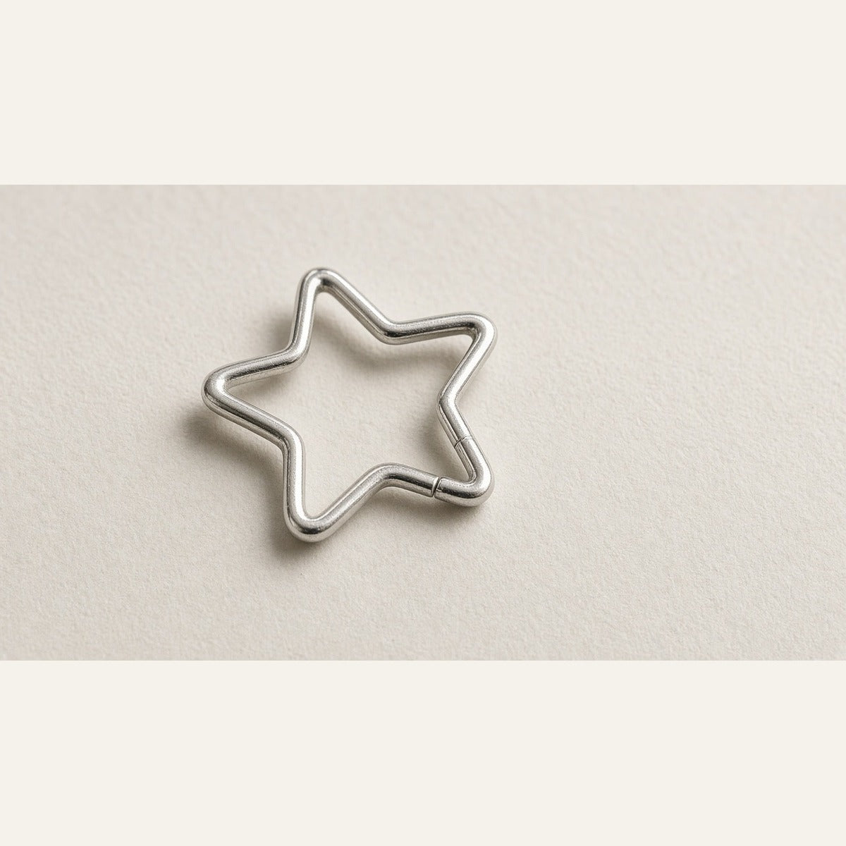 SnoozeStuds star sleep earring on off-white — Eight Meridian